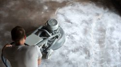 a technician polishing concrete floors