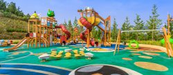 A colourful playground with a rubber surface for safety